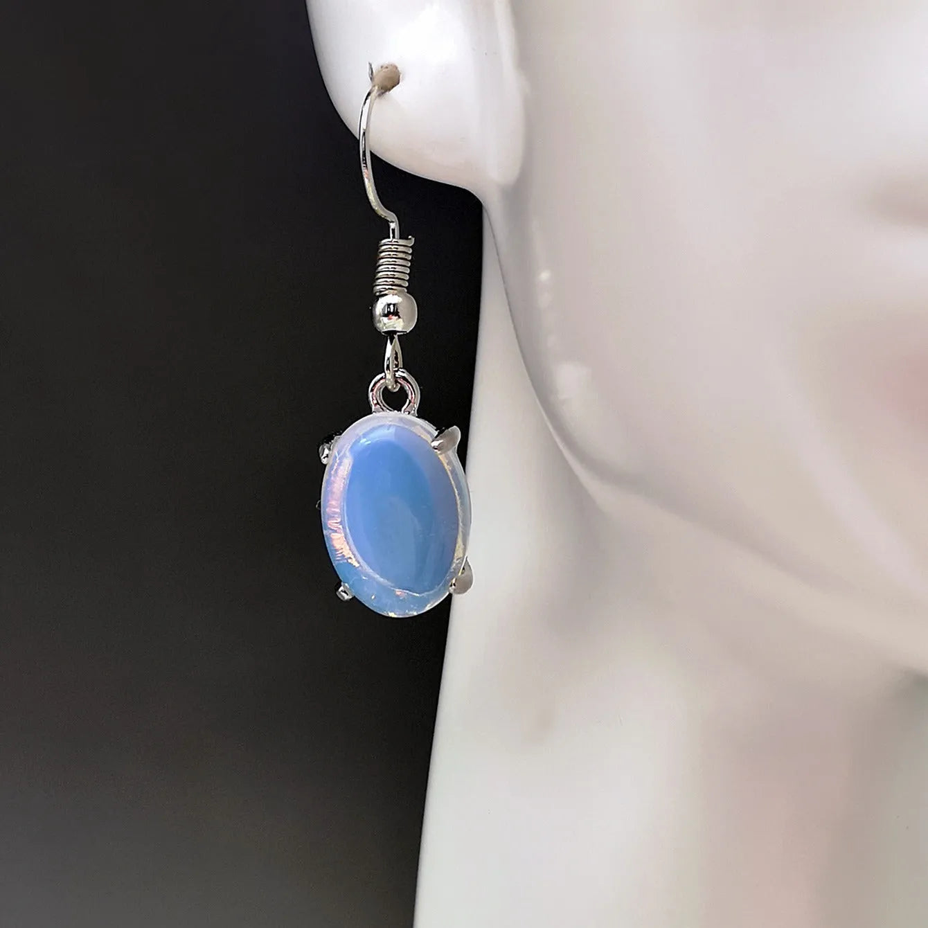 Moonlight white opal earrings with a retro cross pendant in a drop shape
