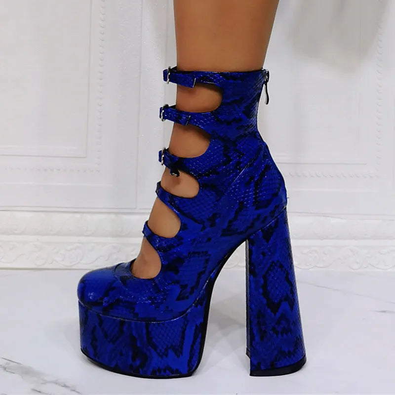 Women's black patent leather platform high heels with a thick heel and buckle-fastened serpentine belt.