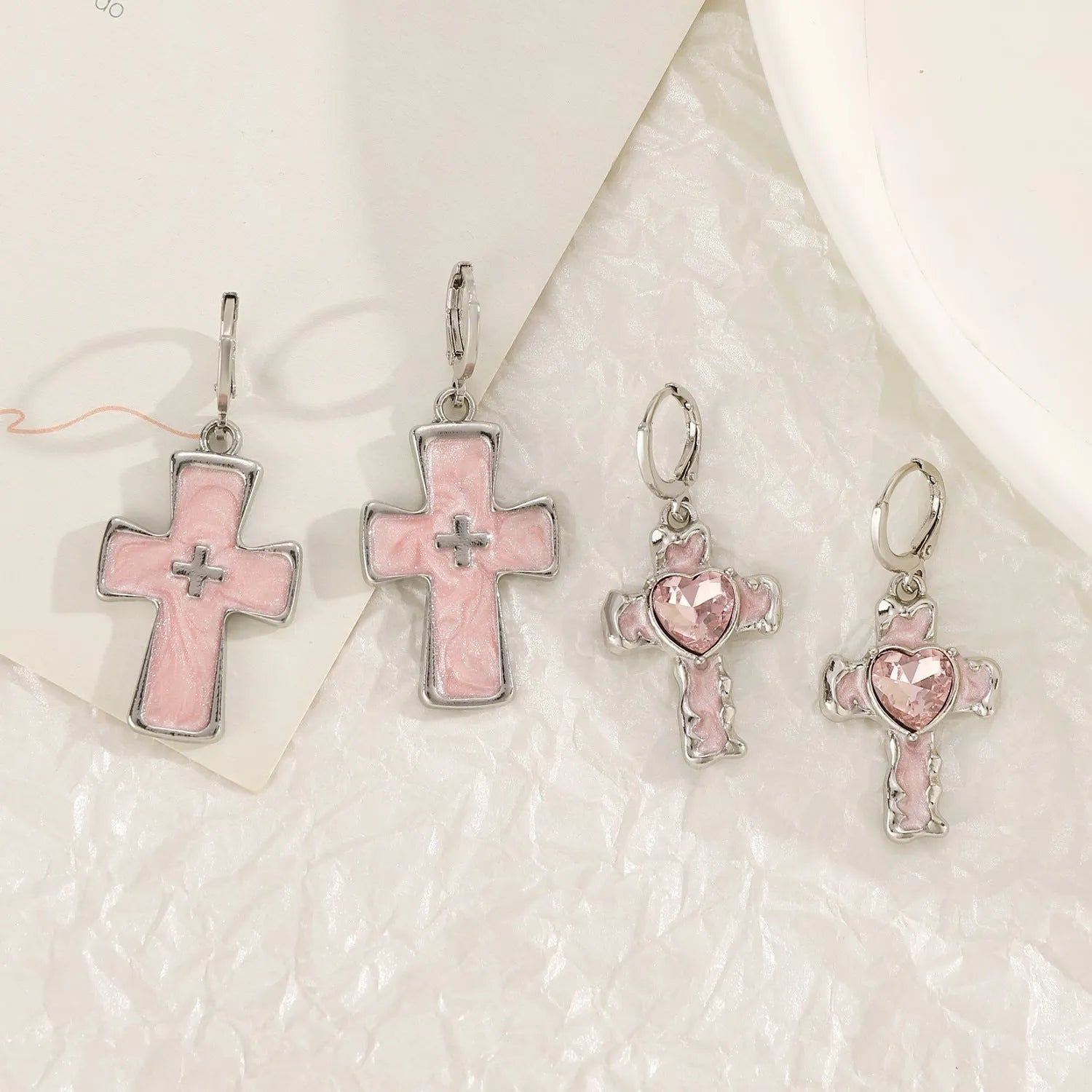 Women's alloy earrings with crystal cross designs in five colour options including white, peach heart, and antique silver
