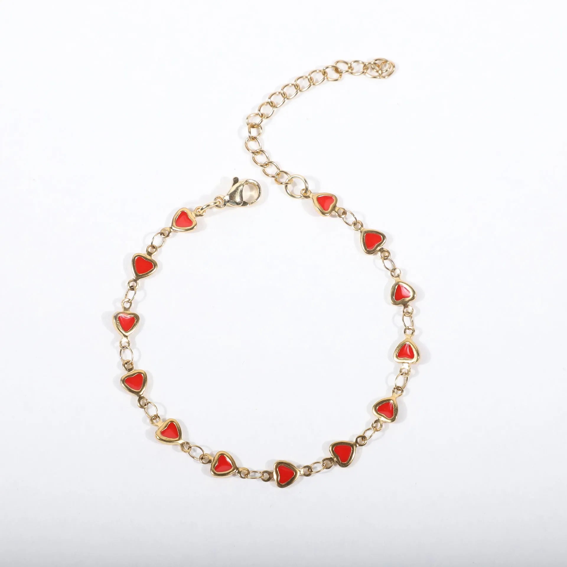 Stainless steel adjustable bracelet with a heart charm, shown in gold colour plating.