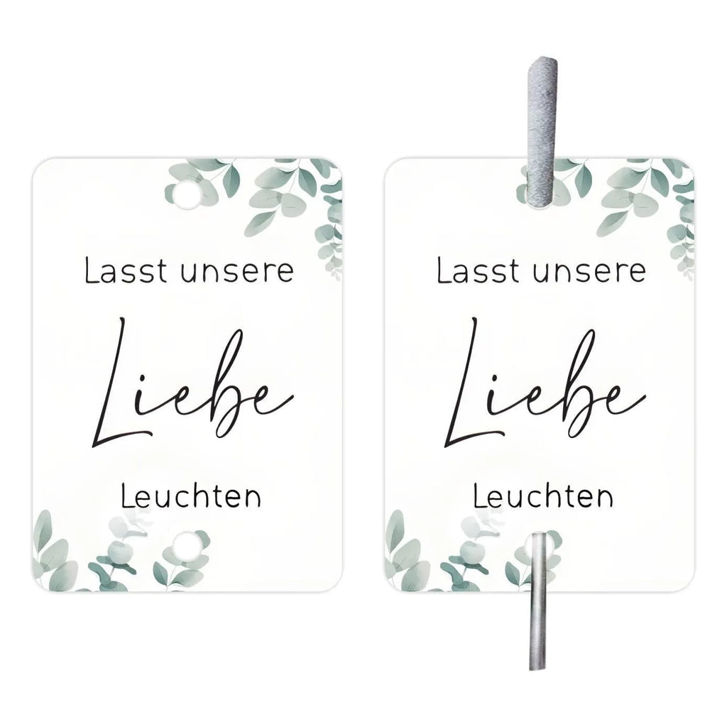 White decorative paper labels with fireworks design and I Make Love sparkling text