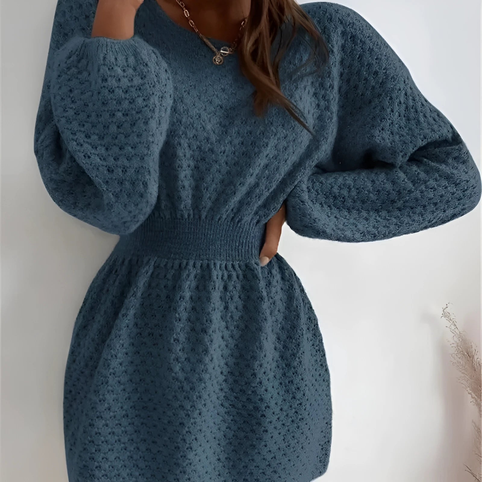 Blue women's knitted dress with fitted waist and hand-crocheted flower decorative elements