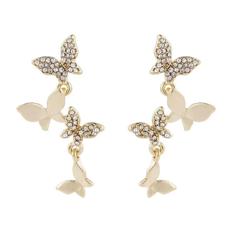 Women's butterfly copper drop earrings with gold finish for pierced ears
