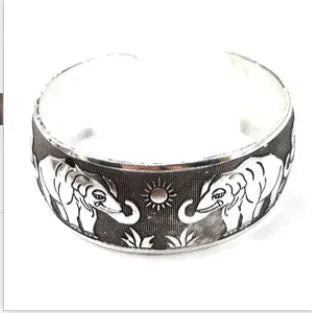Ethnic carved open Miao silver bracelet in alloy with elephant or turtle colour finish