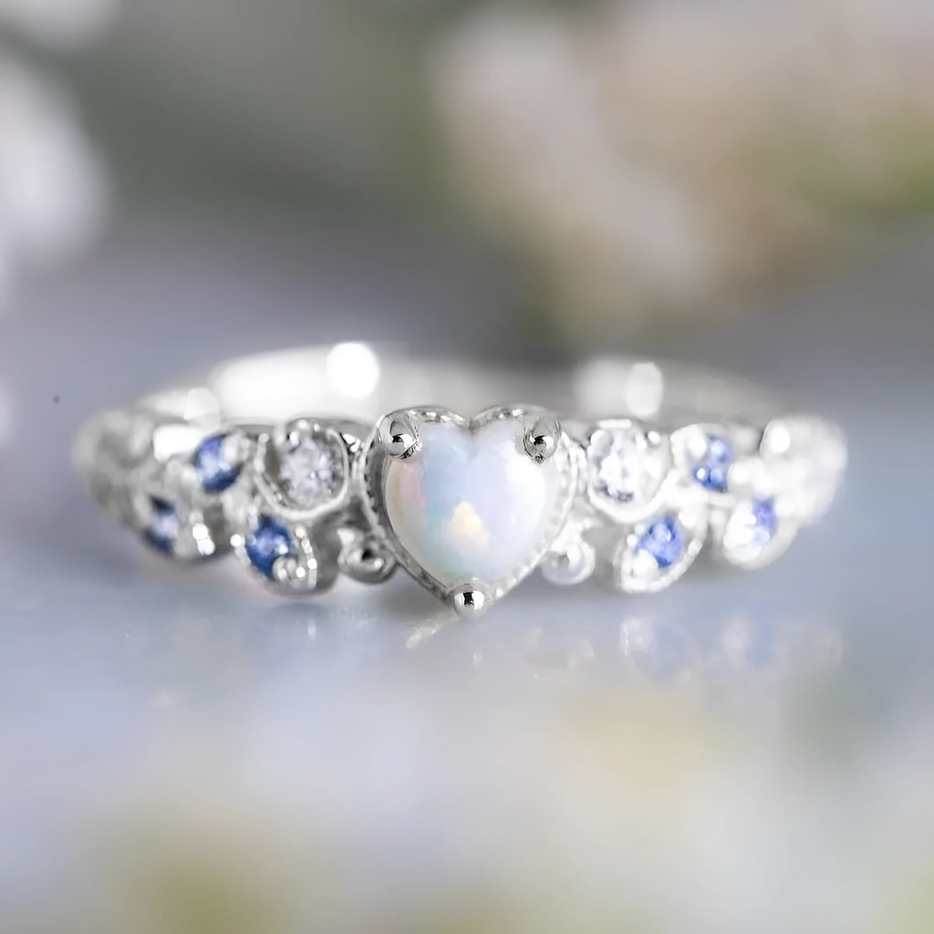 Peach-coloured women's heart-shaped alloy ring with floral and opal ocean design details.