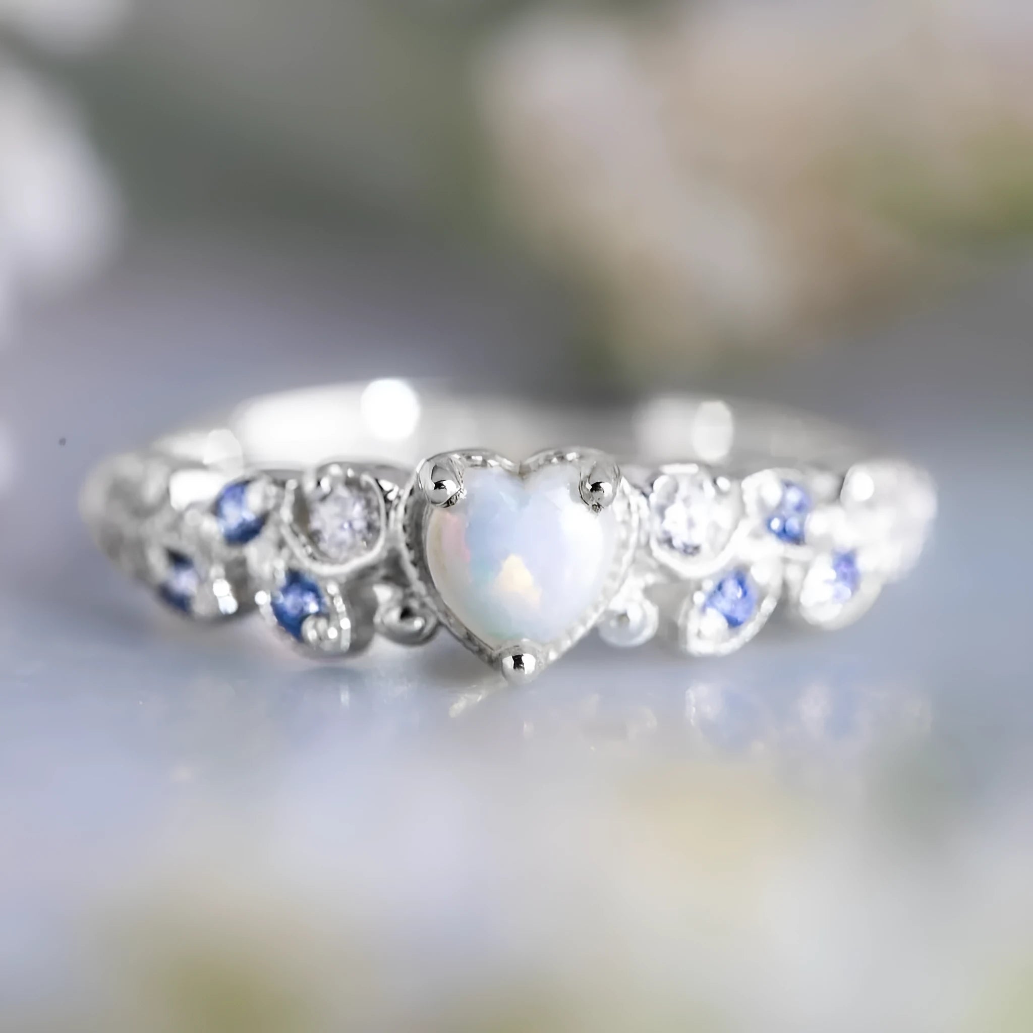 Peach-coloured women's heart-shaped alloy ring with floral and opal ocean design details.