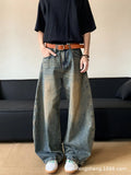 Men's retro blue distressed denim pants with a slim wide-leg fit and a zipper fly.