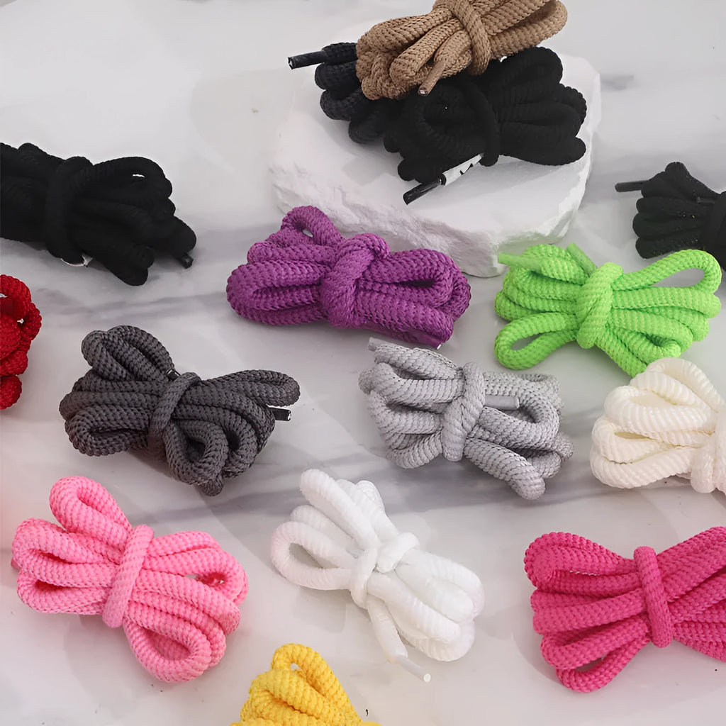 Oval elastic shoelace adapter ropes in various colours on a white background.