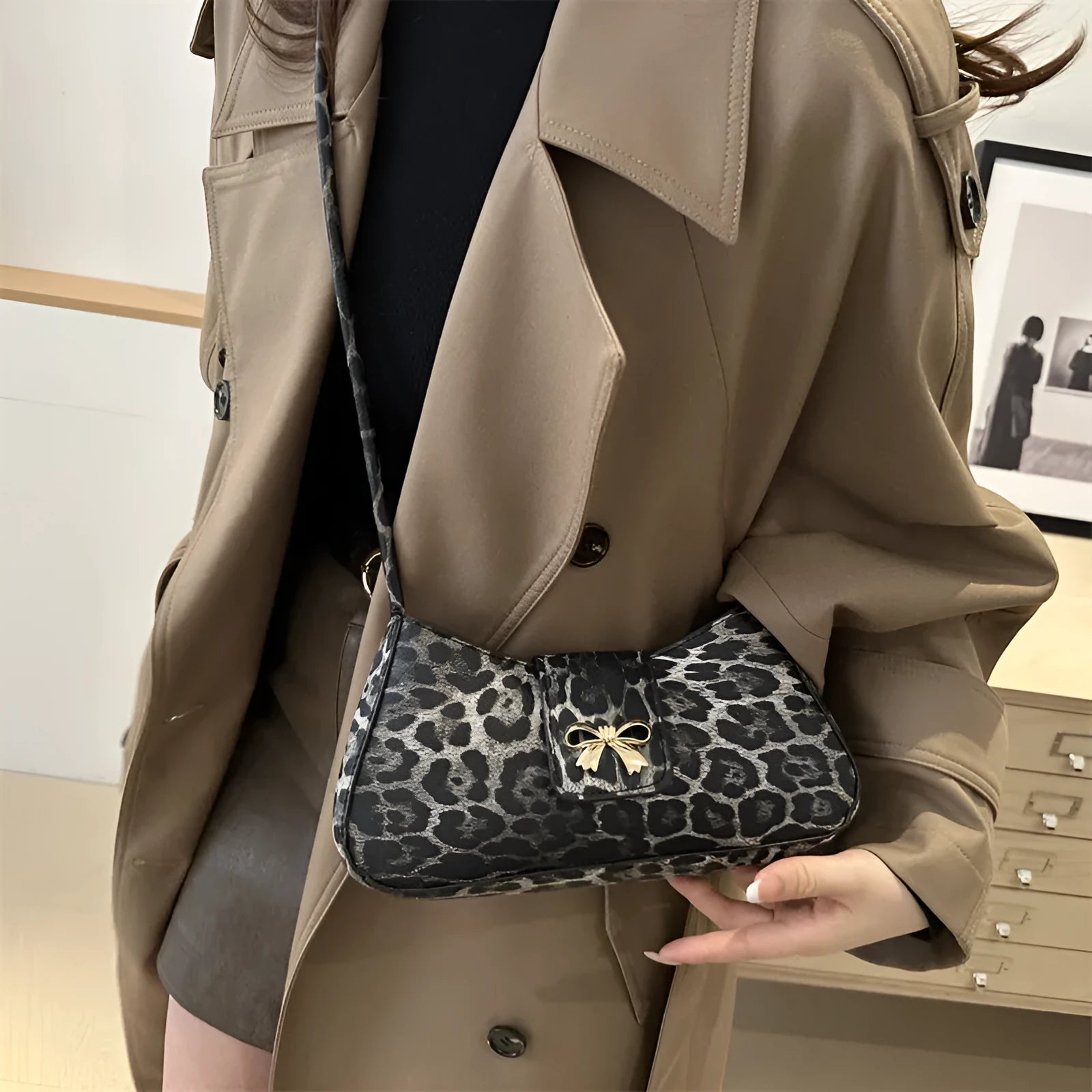 Casual women's handbag in black with sandwich pocket, measuring 27cm wide and made from PU leather