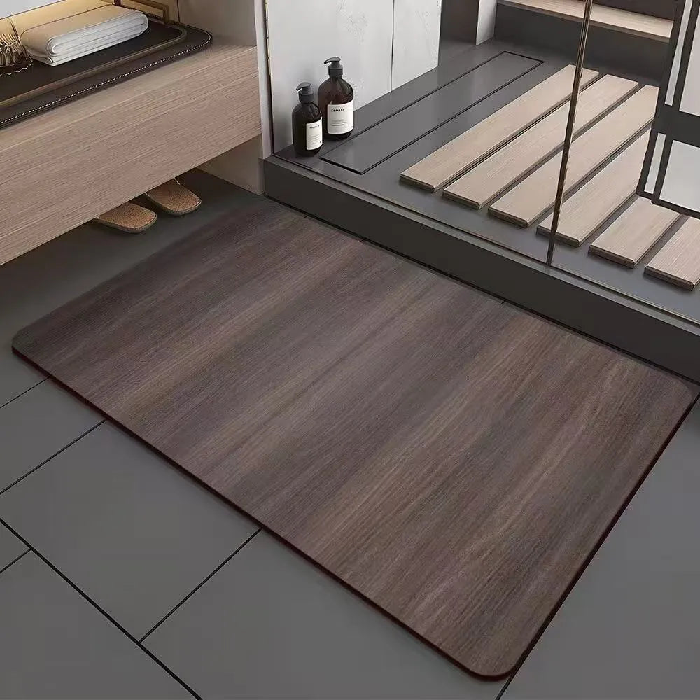 Square diatom ooze floor mat with geometric wood grain pattern in a bathroom setting.