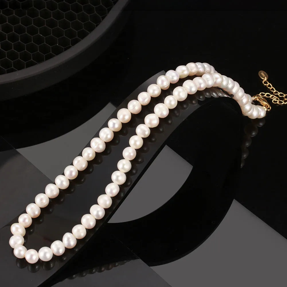 Women's silver adjustable necklace with a single natural freshwater pearl centre.