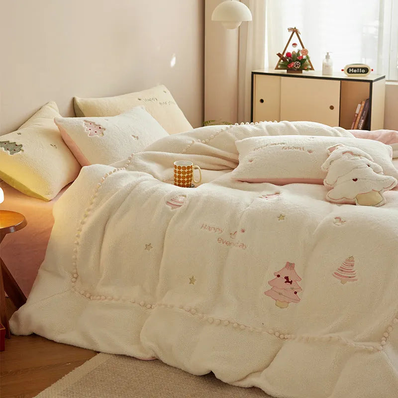Princess-style four-piece bedding set with green Christmas tree pattern on a bed.