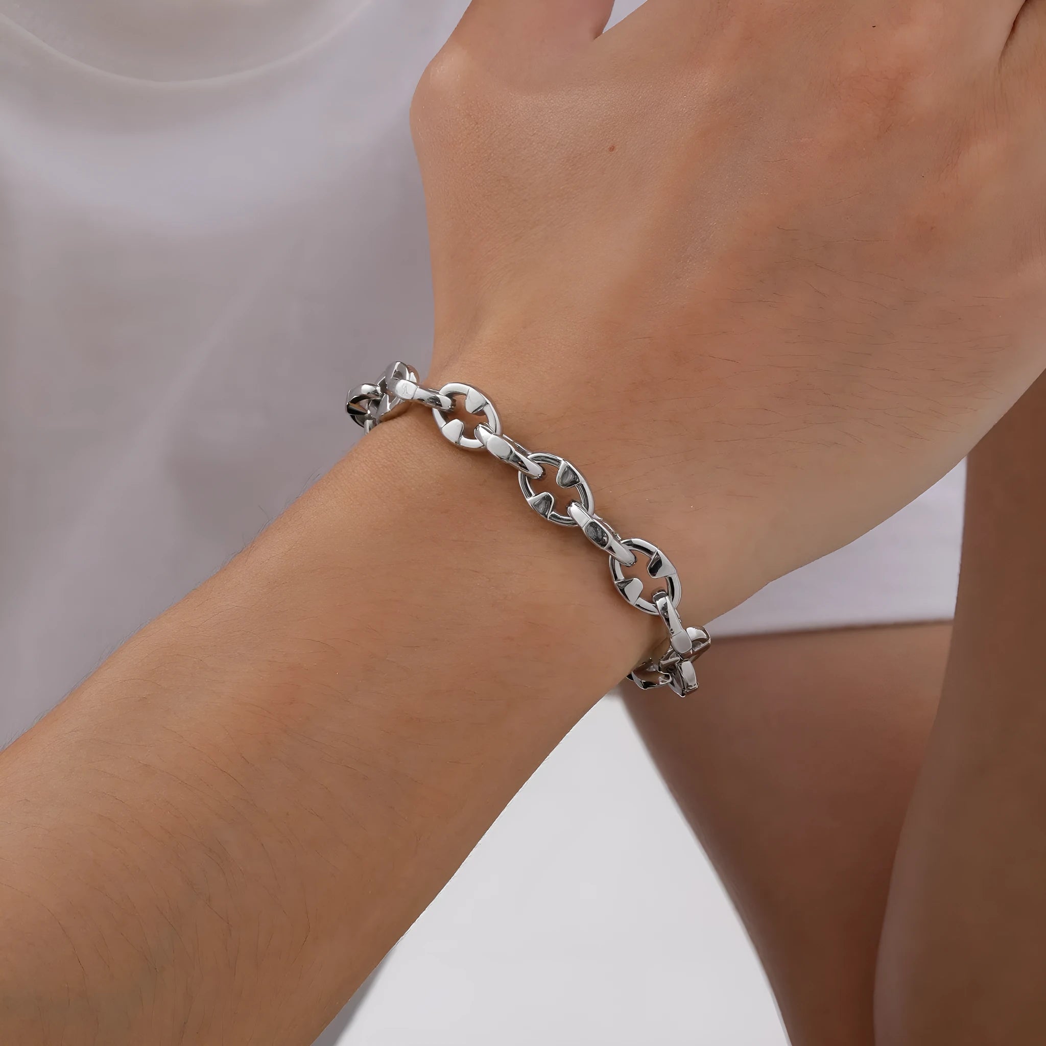 A thick, geometric chain link bracelet made of stainless steel, shown in a steel colour.