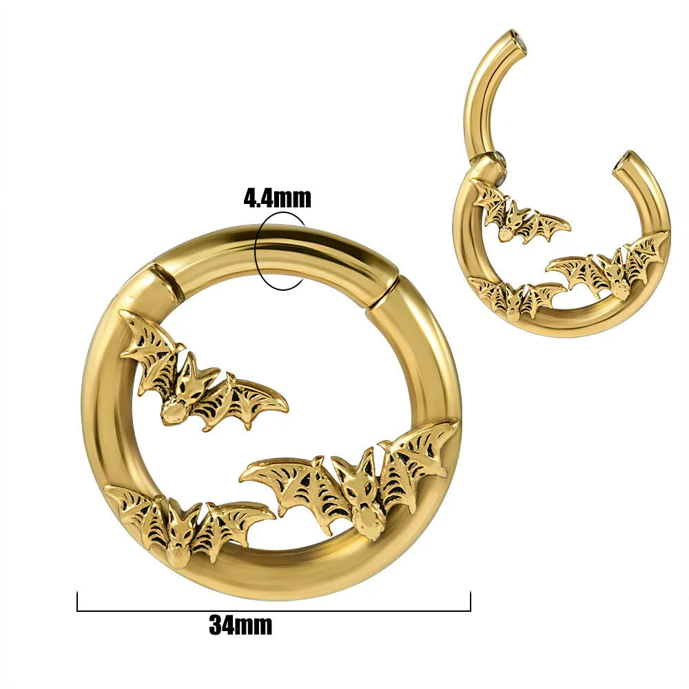 A pair of silver totem pattern stainless steel fashion earrings on a white background.