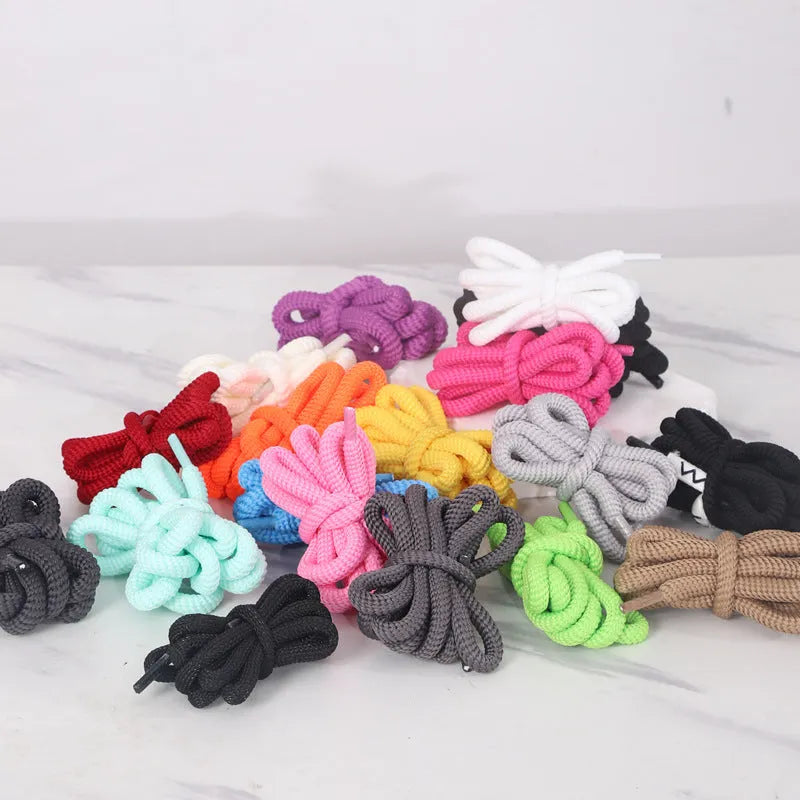 Oval elastic shoelace adapter ropes in various colours on a white background.