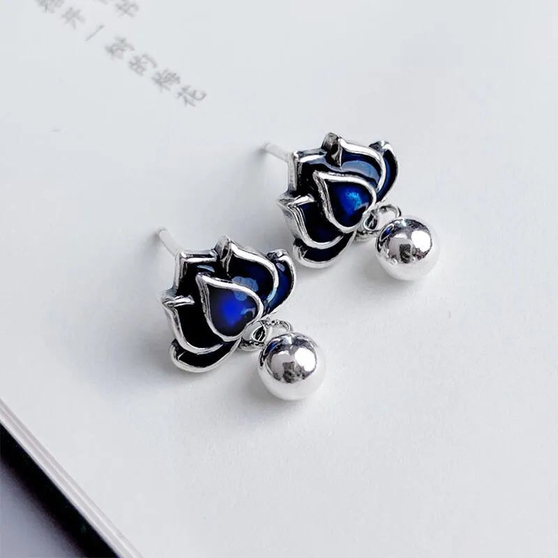 Blue Lotus alloy stud earrings with detailed lotus seedpod tassel and flower design