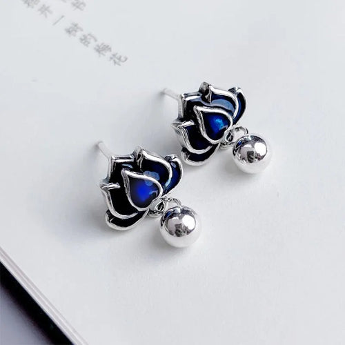 Blue Lotus alloy stud earrings with detailed lotus seedpod tassel and flower design