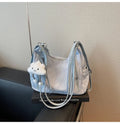 Soft black PU leather women's backpack shown with detachable pendant accessory.