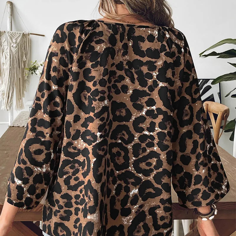 Women's multicolor leopard print V-neck pullover top with half sleeves and pleating detail
