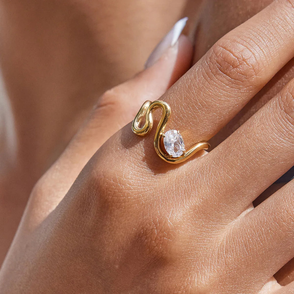 Silver tone geometric zircon ring with European-American styling on stainless steel background