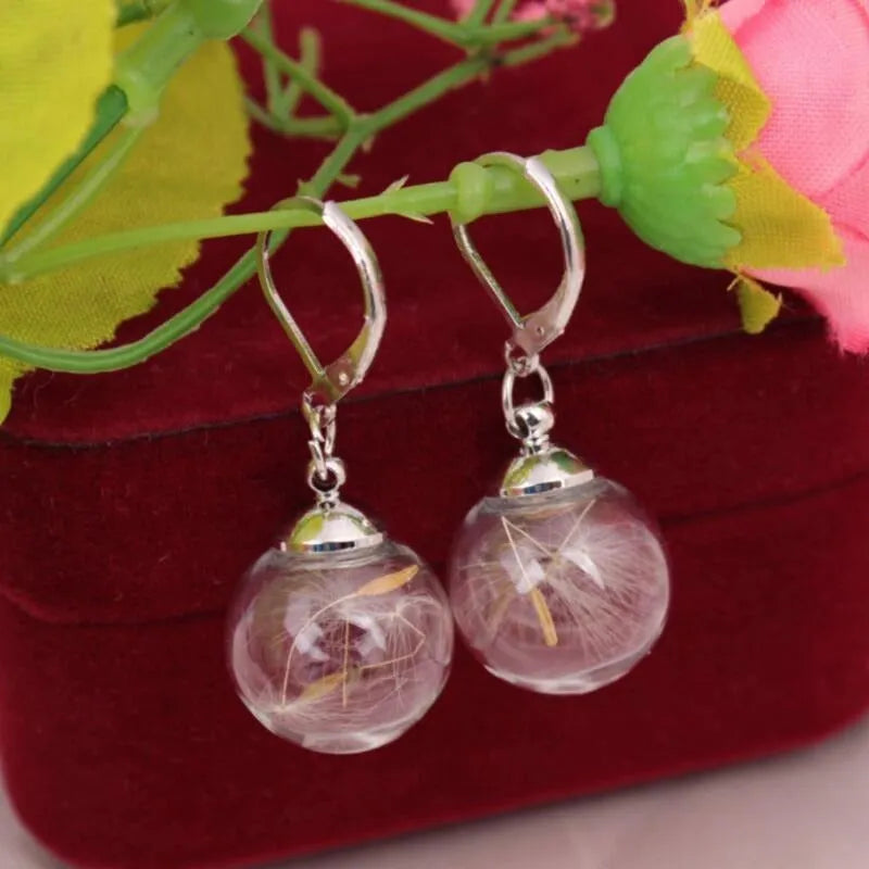 Transparent 16mm glass ball earrings with crystal dandelion seed design on silver French hooks