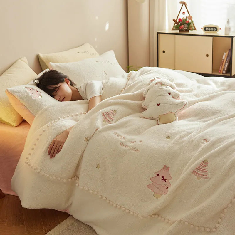 Princess-style four-piece bedding set with green Christmas tree pattern on a bed.