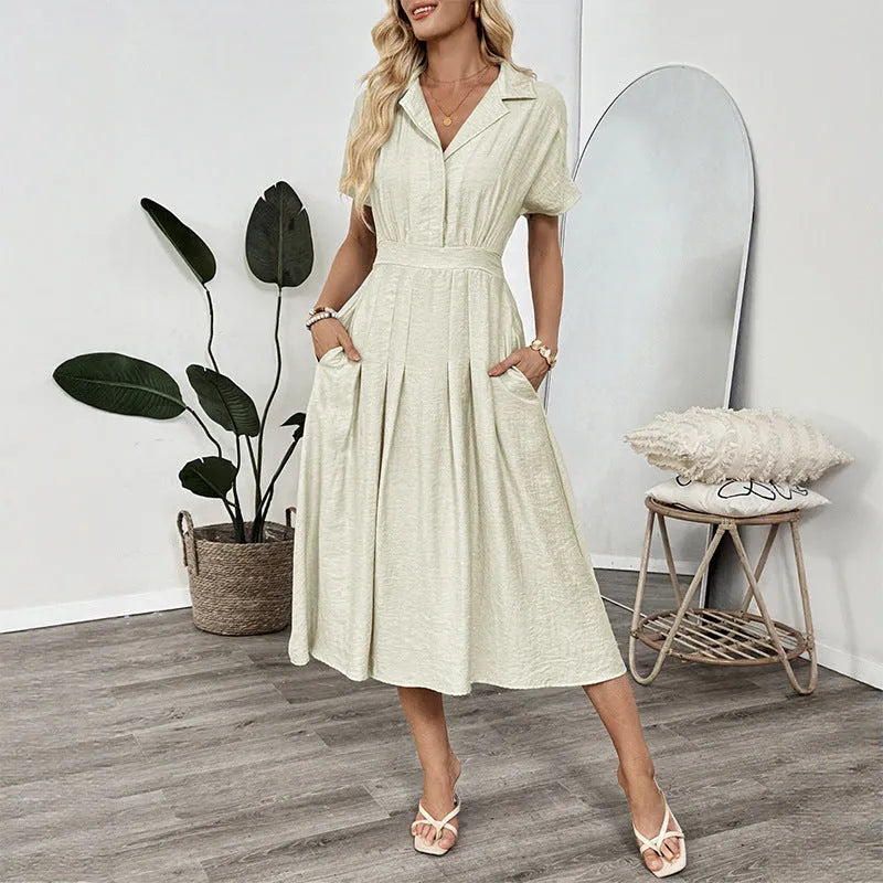 Light green women's shirt dress with lapel collar, waist-tight skirt, and pockets