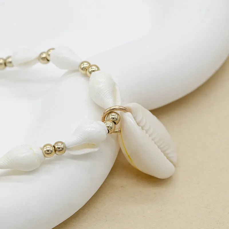 White conch shell necklace with mother of pearl pendant on regular chain, electroplated finish