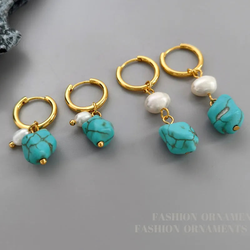 Geometric turquoise and cultured pearl earrings in short stud and long dangle styles on copper settings.