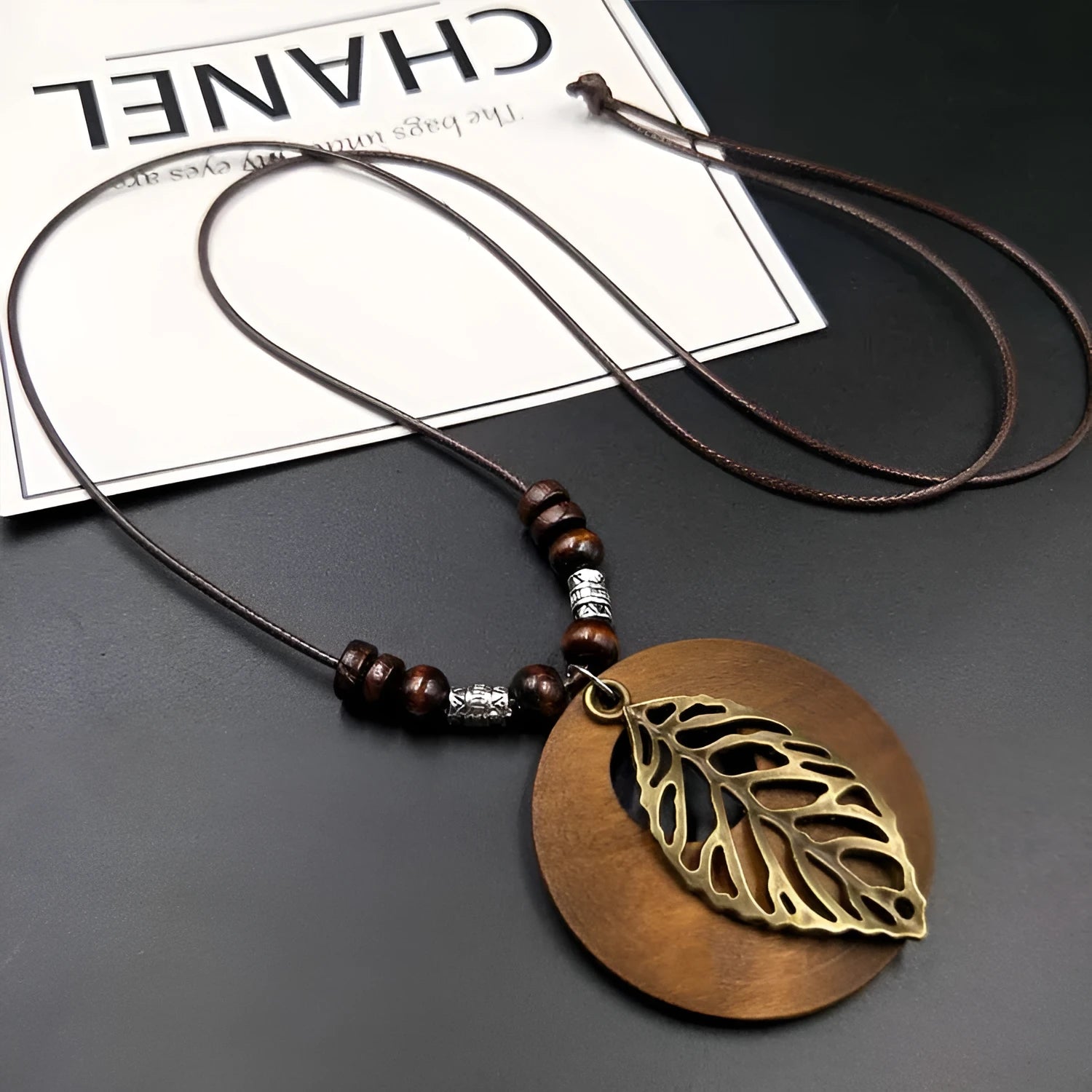 Wooden leaf ethnic necklace on adjustable wax cord chain with electroplated metal accents