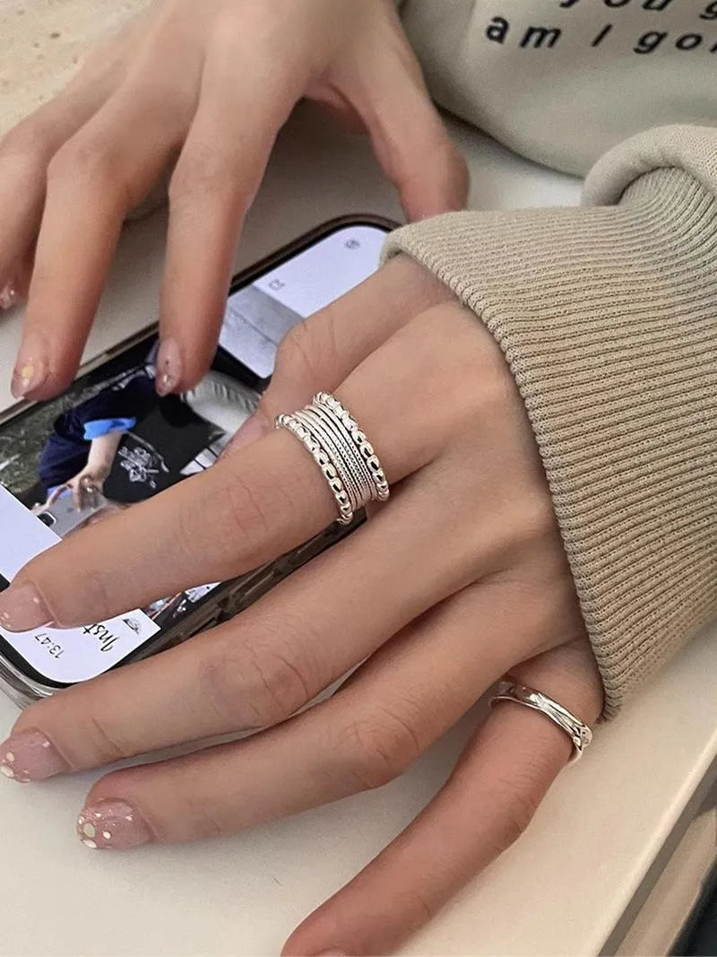 Copper alloy adjustable ring with geometric woven multilayer design