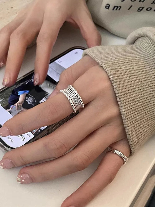 Copper alloy adjustable ring with geometric woven multilayer design