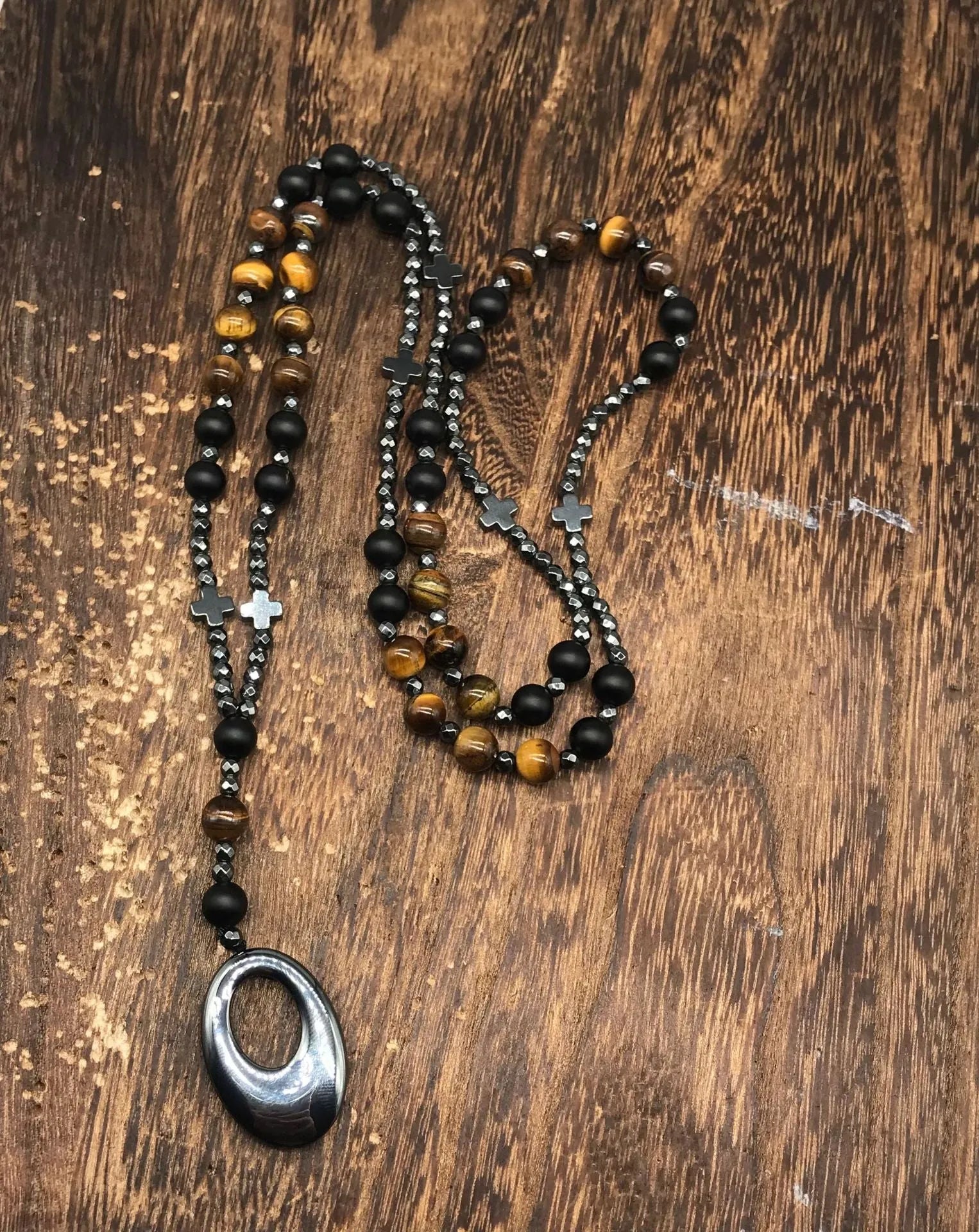 Men's stone geometric cross pendant on an 80cm ball bead chain with safety lock.