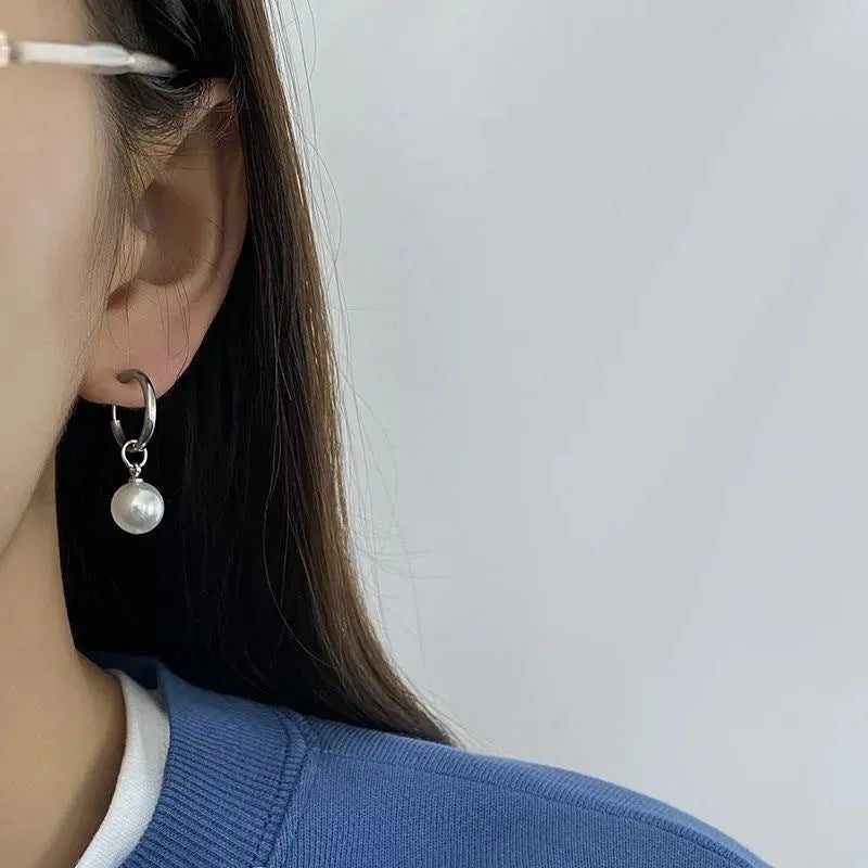 Geometric alloy drop earrings for women with round titanium steel pearl accents.