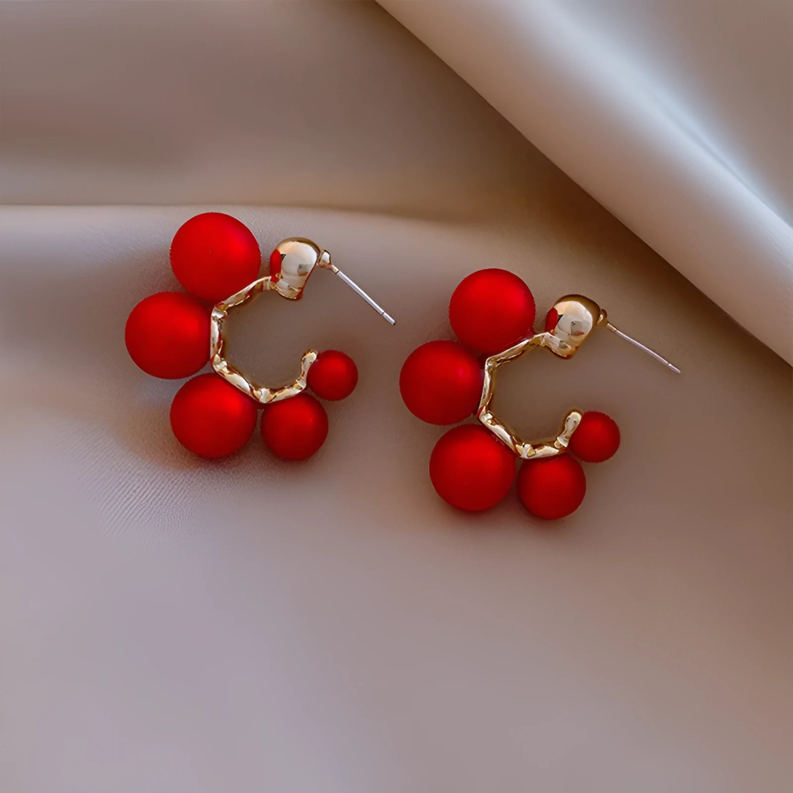 Round alloy bell drop earrings in red colour for pierced ears