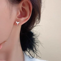 Women's fashion fishtail earrings in copper with electroplated white gold and yellow gold finishes