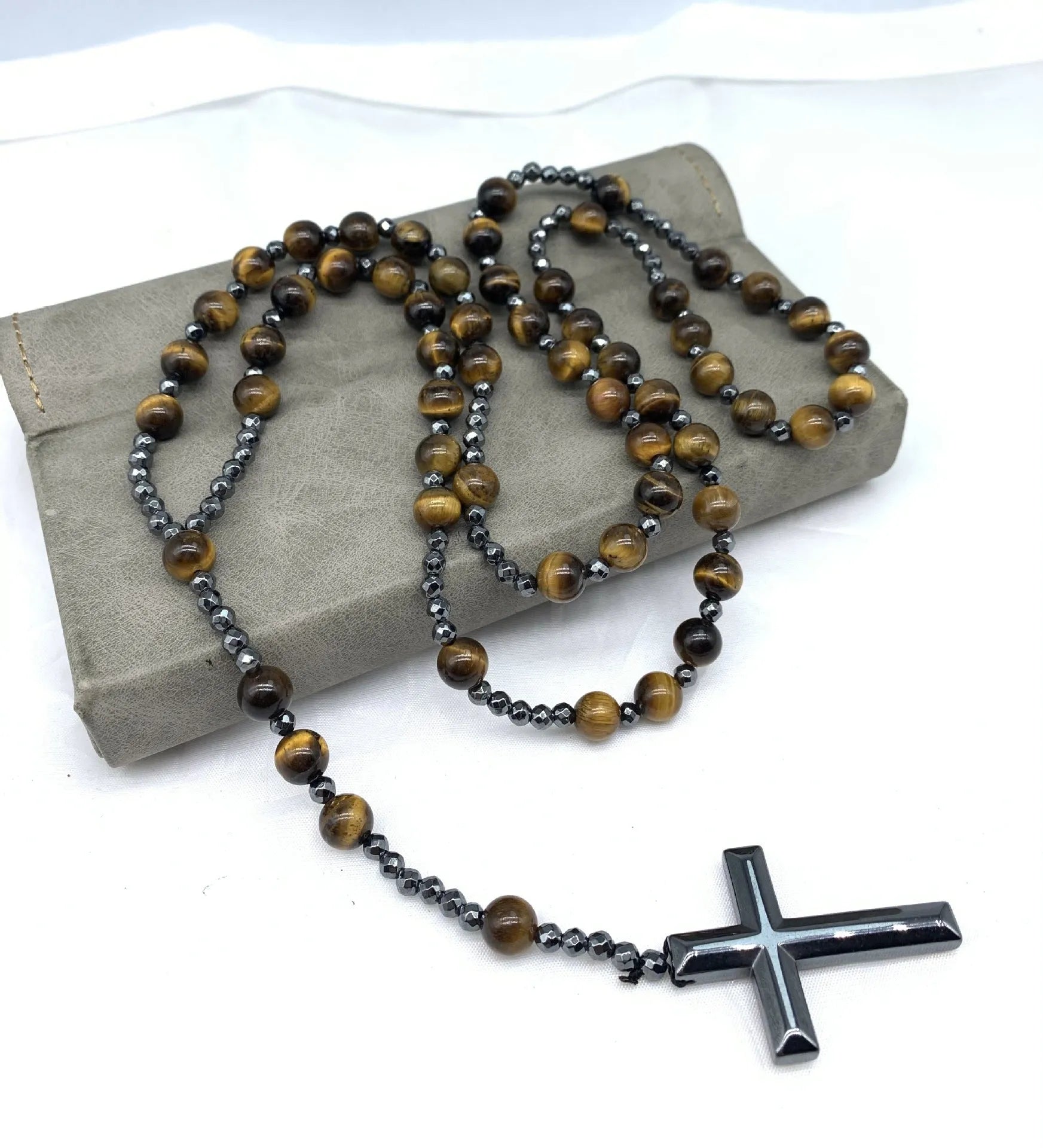 Men's stone geometric cross pendant on an 80cm ball bead chain with safety lock.