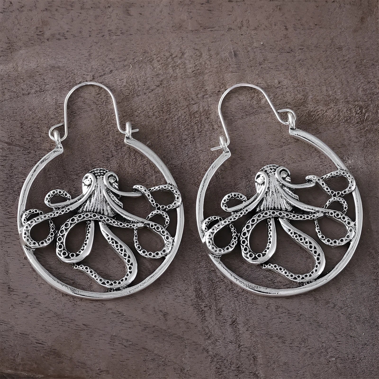 Vintage style octopus drop earrings in antique silver colour with detailed tentacle design