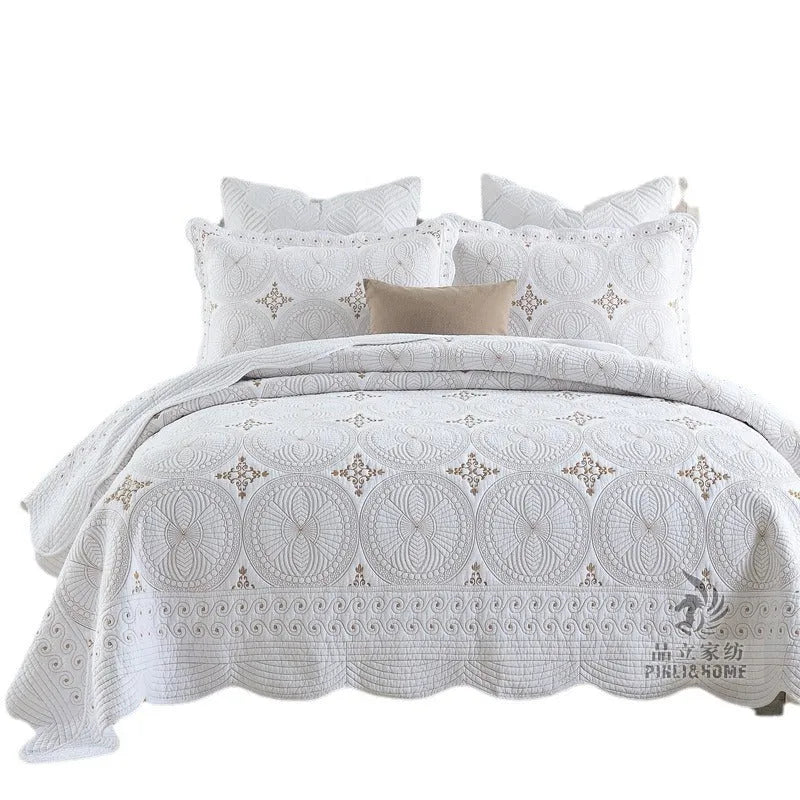 European-style cotton embroidered bedspread and pillowcase set on a 1.8 metre bed.