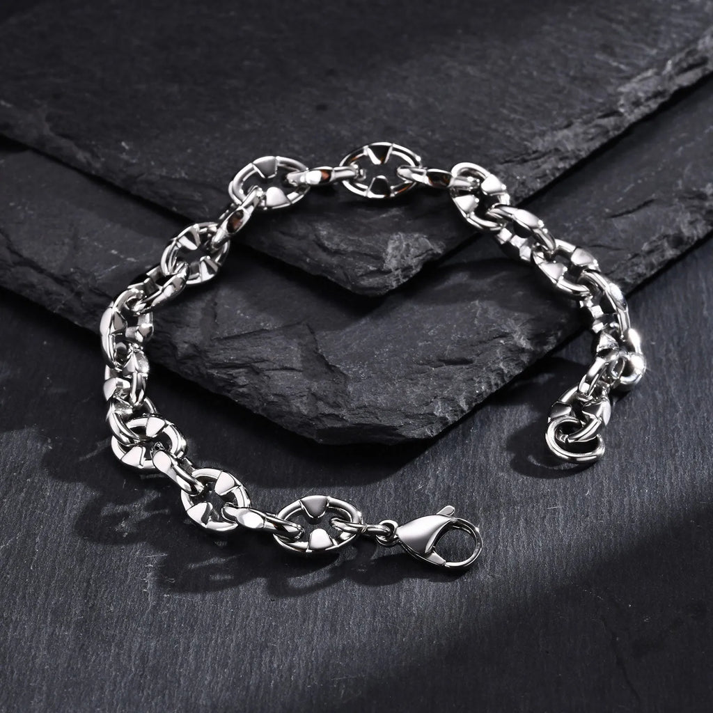 A thick, geometric chain link bracelet made of stainless steel, shown in a steel colour.