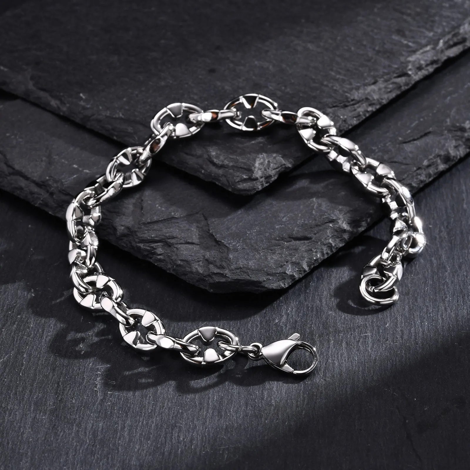 A thick, geometric chain link bracelet made of stainless steel, shown in a steel colour.