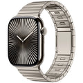 Stainless steel Apple Watch strap with magnetic buckle in multiple colour options on a wrist.