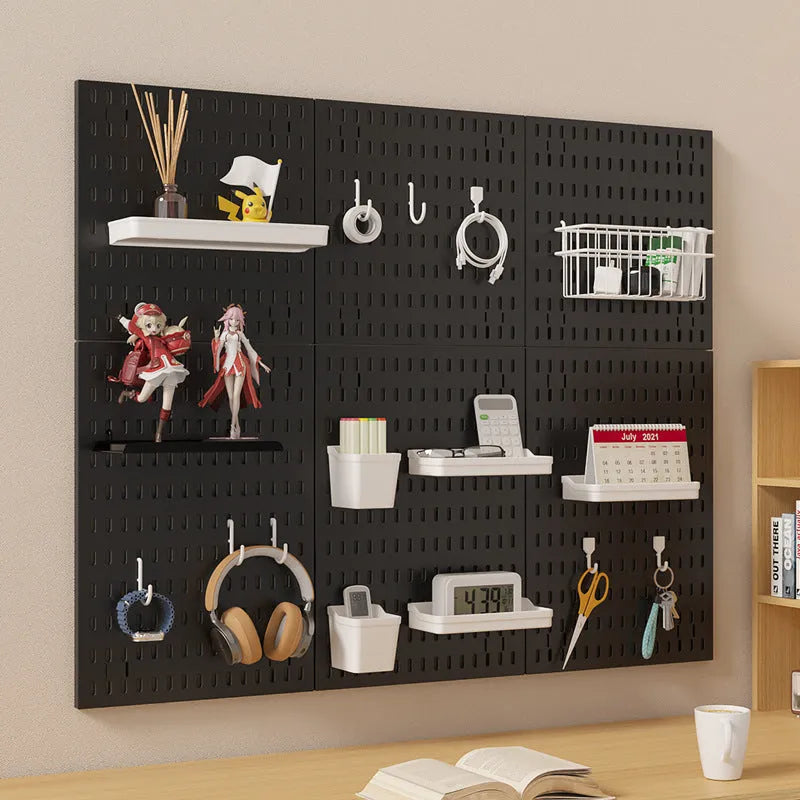 White punch-free plastic wire-wrap board storage rack mounted on a wall with hooks