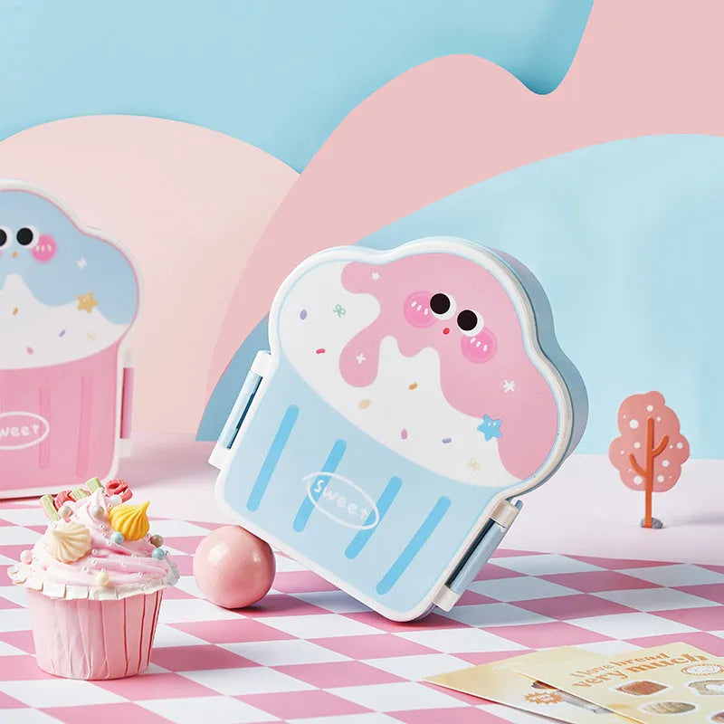 Pink and blue creative ice cream shaped plastic lunch box with spoon and fork set on a white background.