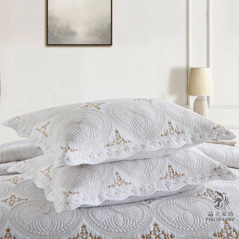European-style cotton embroidered bedspread and pillowcase set on a 1.8 metre bed.