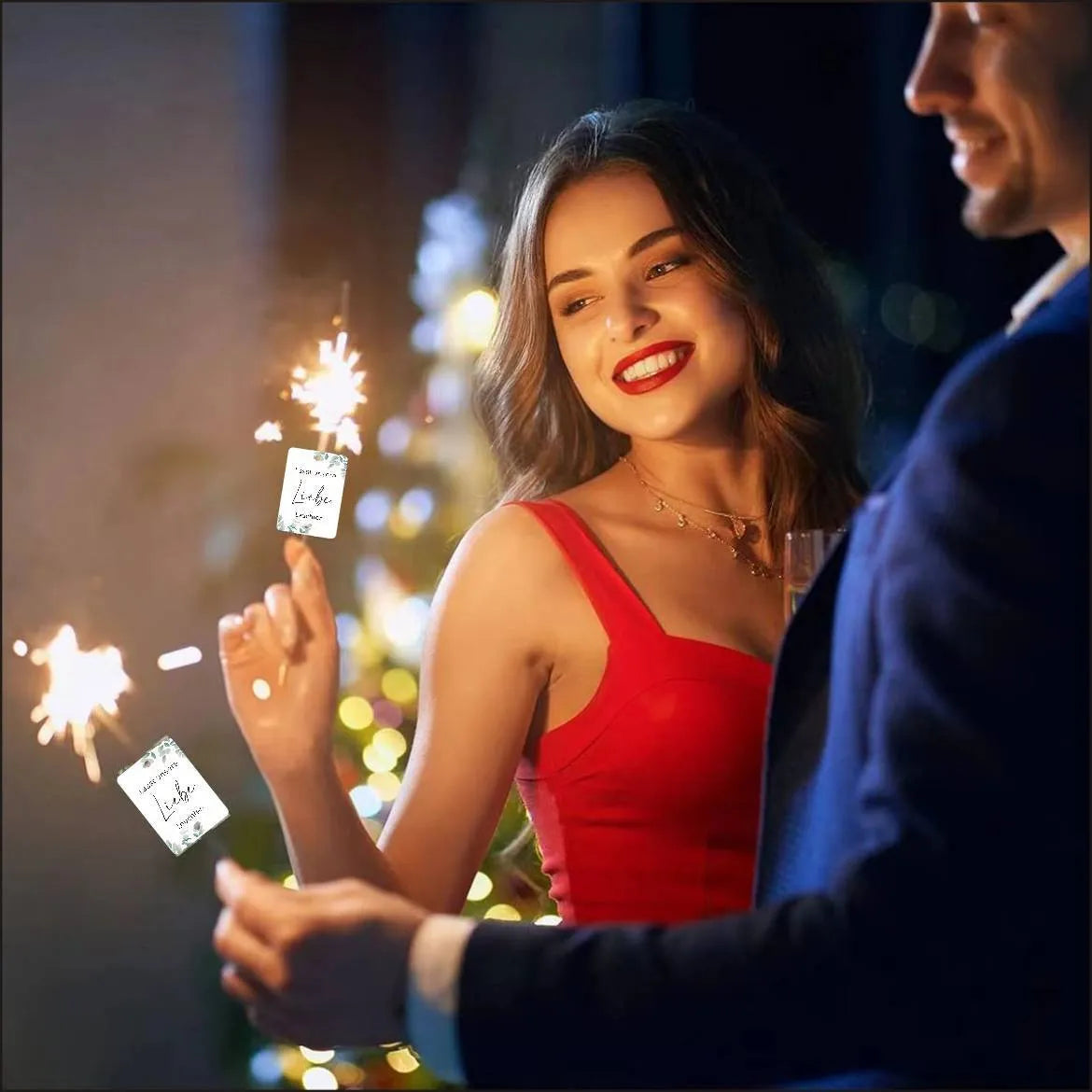 White decorative paper labels with fireworks design and I Make Love sparkling text