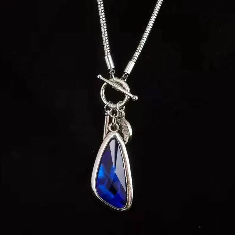 Women's long necklace with geometric pendant on snake bones chain in blue water drop finish