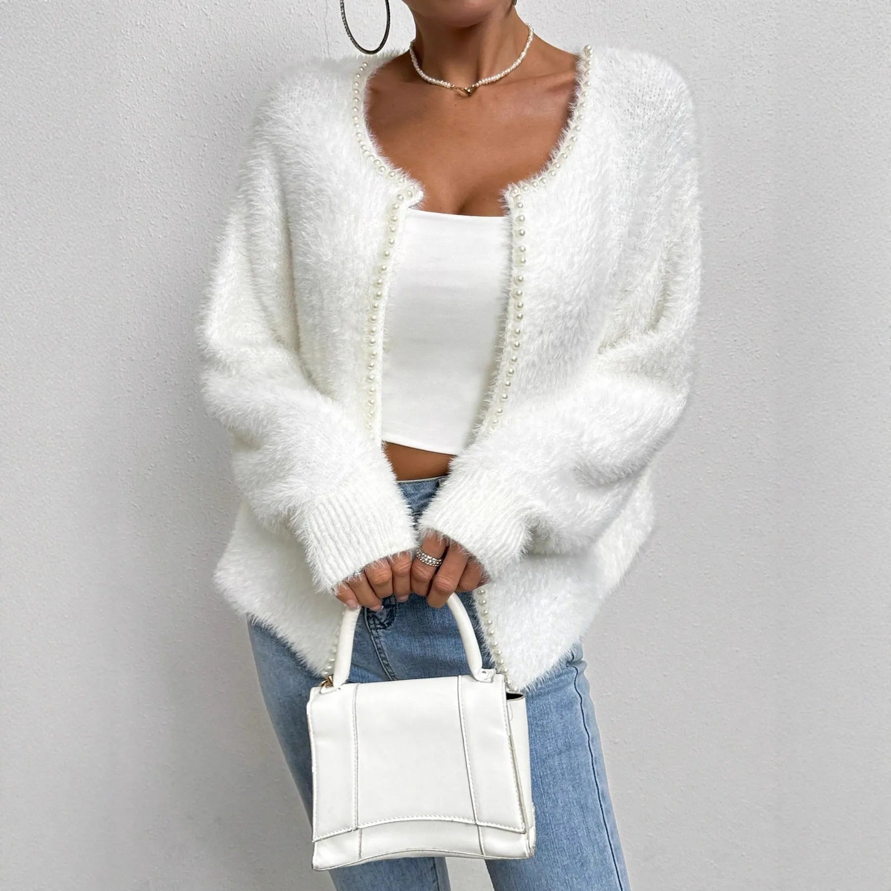 Women's white V-neck cardigan sweater with medium thickness polyester construction