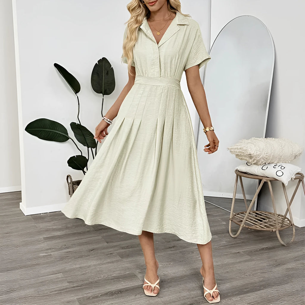 Light green women's shirt dress with lapel collar, waist-tight skirt, and pockets
