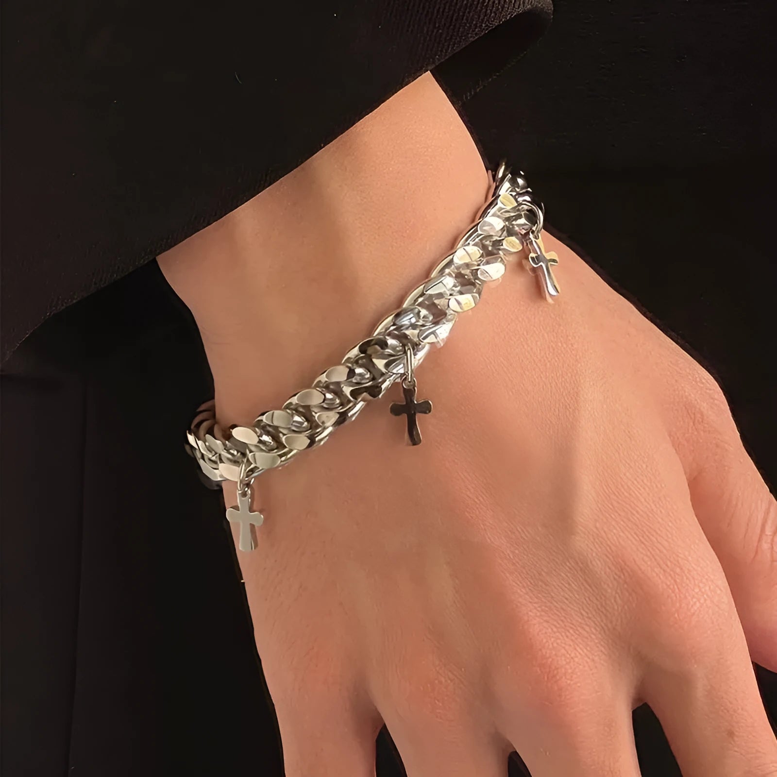 Men's titanium steel geometric bracelet with a cross design on a white background.